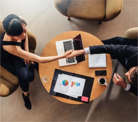 Top-down view of three people collaborating
