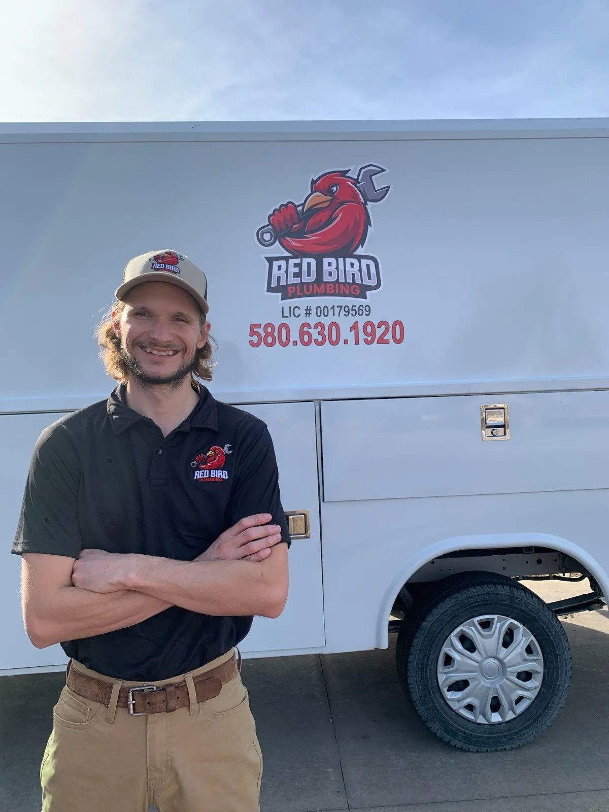 Crew in front of plumbing van