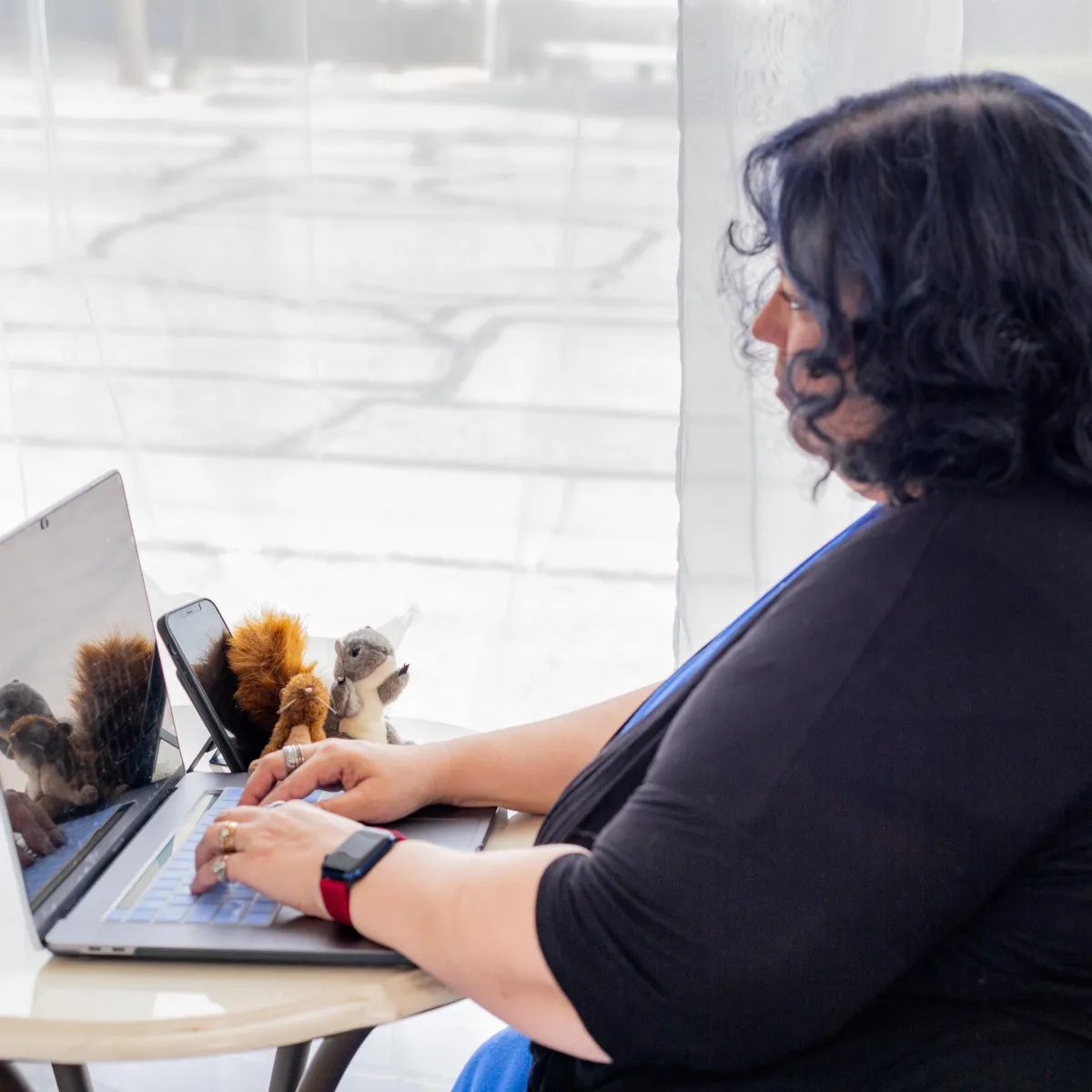 A whimsical illustration of a squirrel in glasses, holding a lasso, surrounded by floating tech icons, set against a clean white background, 1:1 aspect ratio