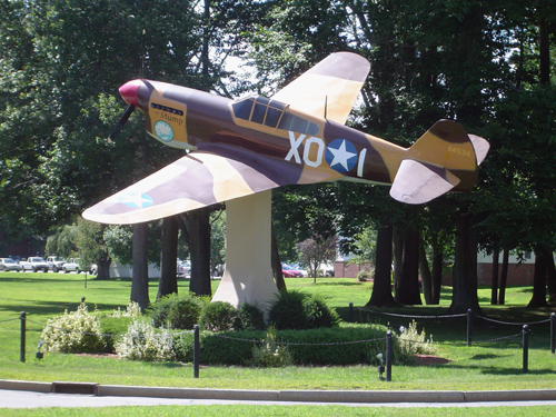 P-40 Warhawk display aircraft at Hanscom Air Force Base, Bedford MA — a landmark for military families buying homes in the area with VA loans