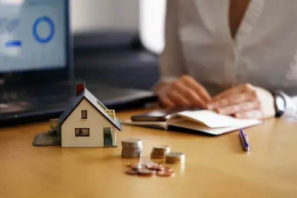 A home buyer reviews their mortgage options with Massachusetts lender Sean Goudreau