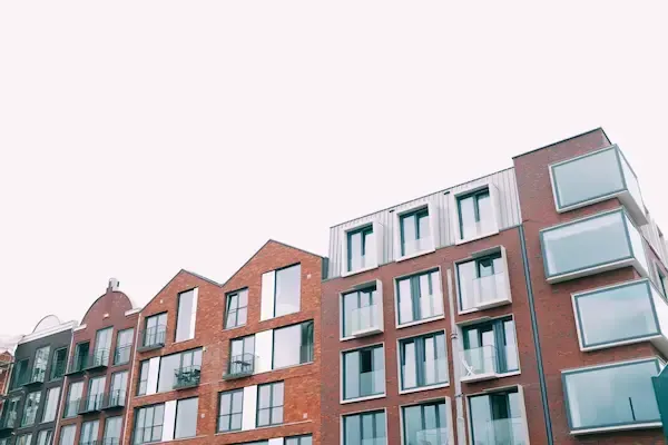 Waltham Massachusetts condominium building exterior — VA and FHA approved condo financing with Sean Goudreau at Rate