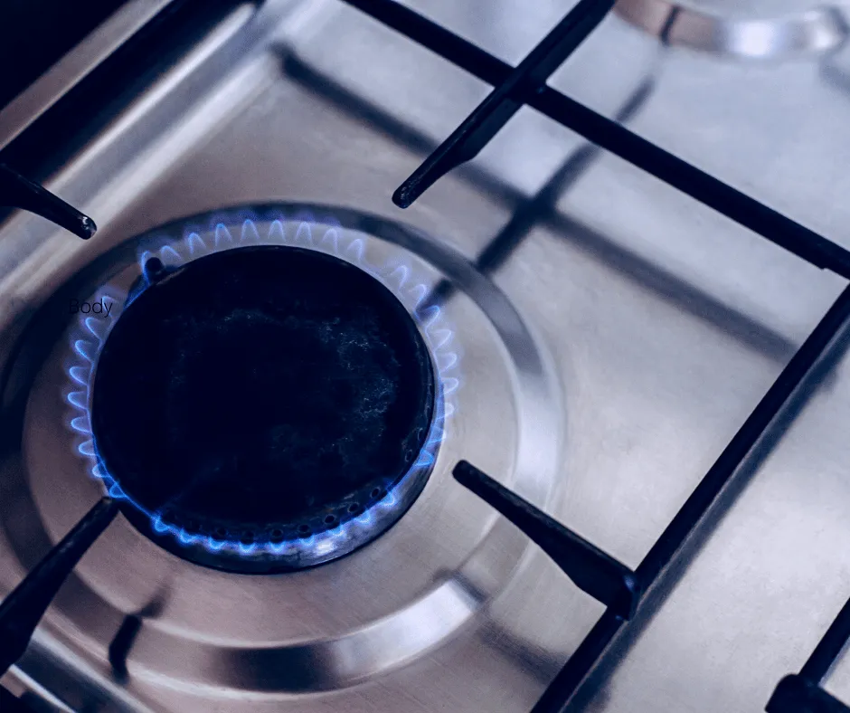 Blue gas flame on a hob representing gas appliance checks included in a CP12 safety inspection