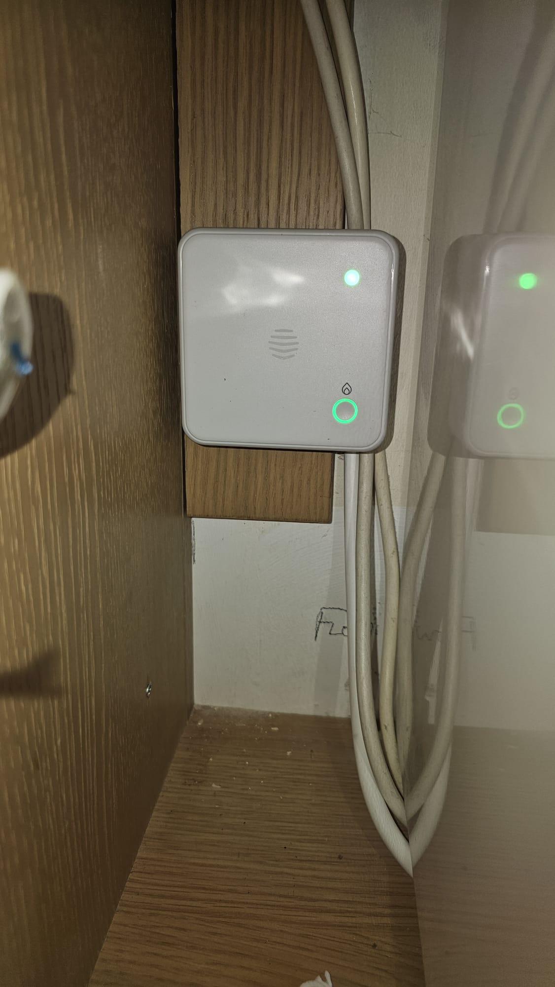 Smart heating receiver with indicator lights installed inside a cupboard