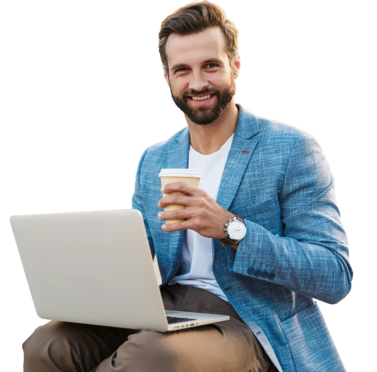 developer on computer with coffee