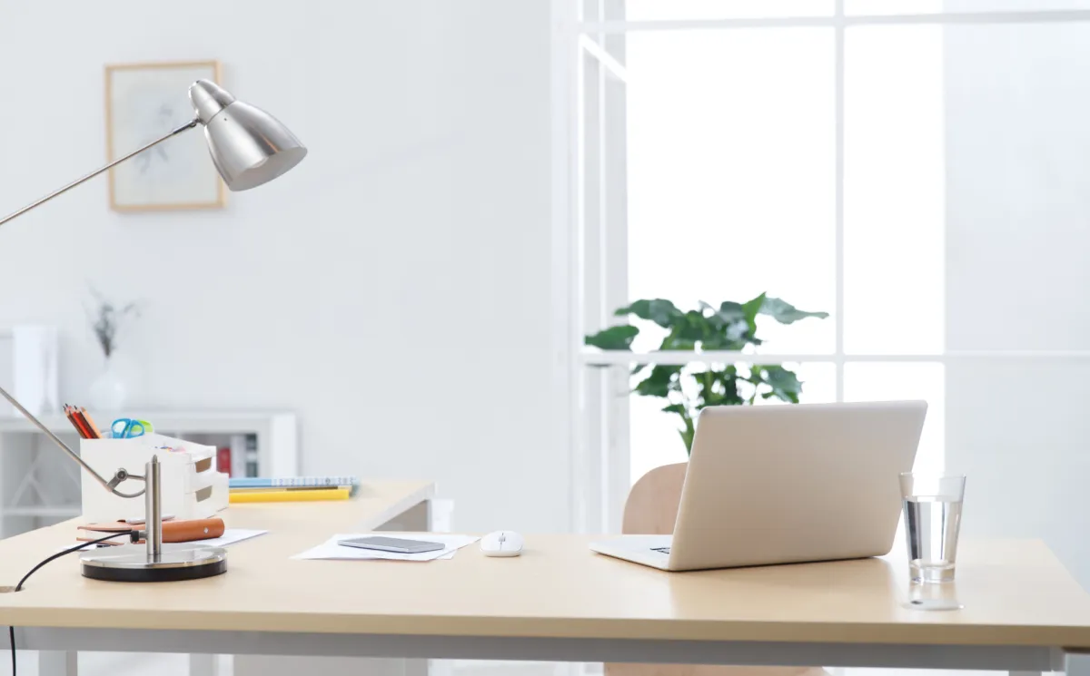 Image of laptop and notepad.