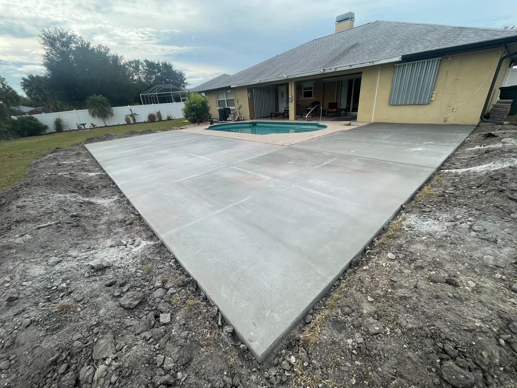 Concrete repair and driveway addition in North Port, FL by Concrete Anywhere