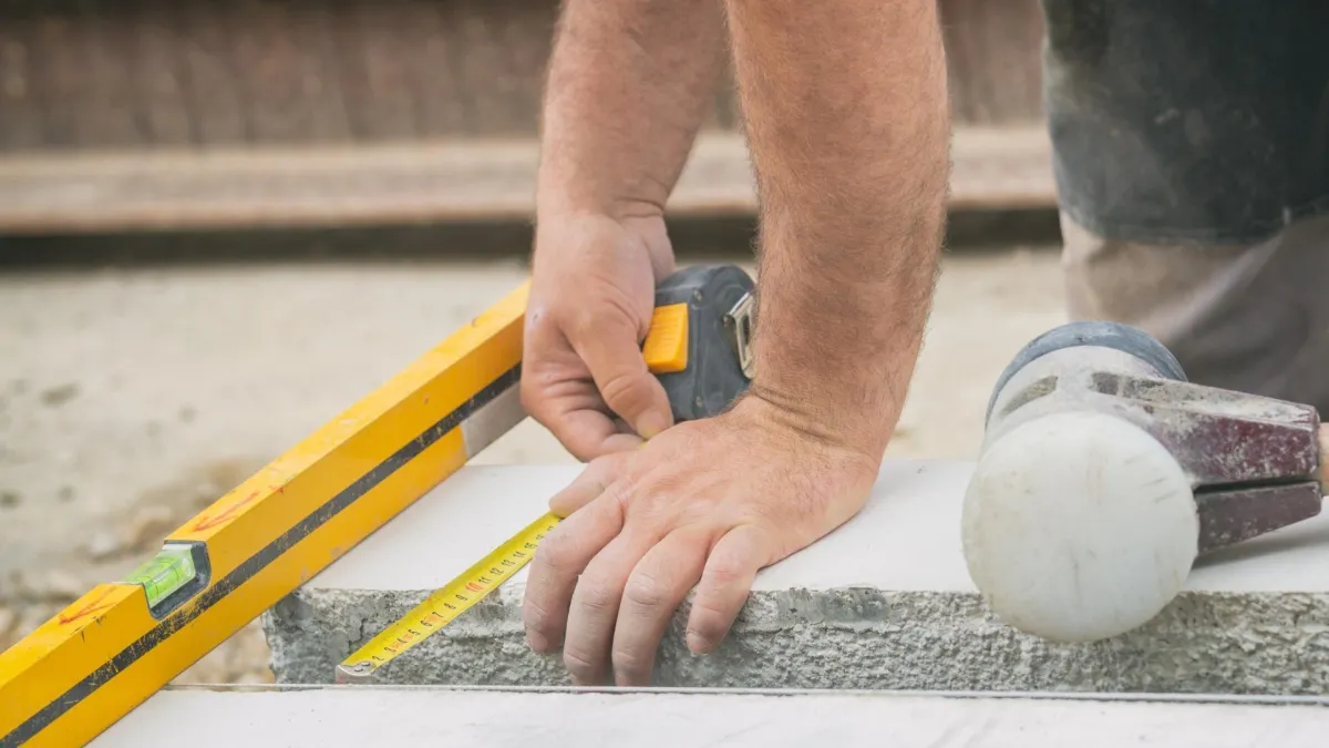 Concrete contractor performing concrete leveling services