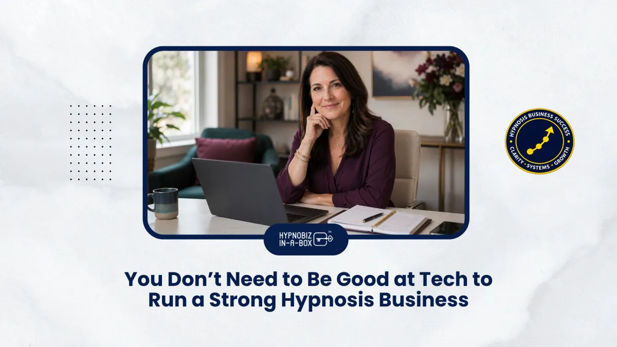 A hypnosis professional working calmly at an organized desk with her business technology under control.