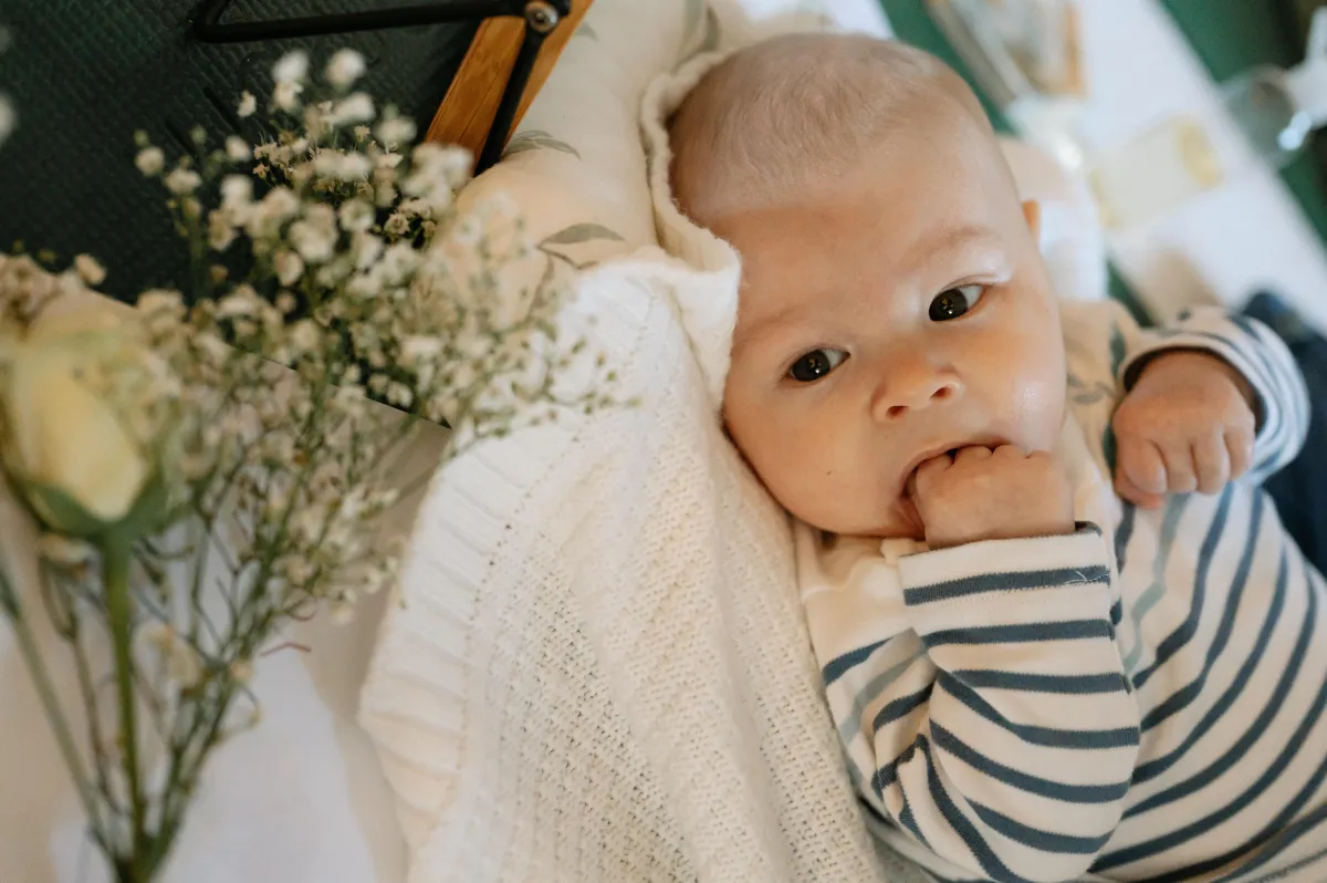 Baby Boy looking in a Little Rosebuds Class having a Massagee