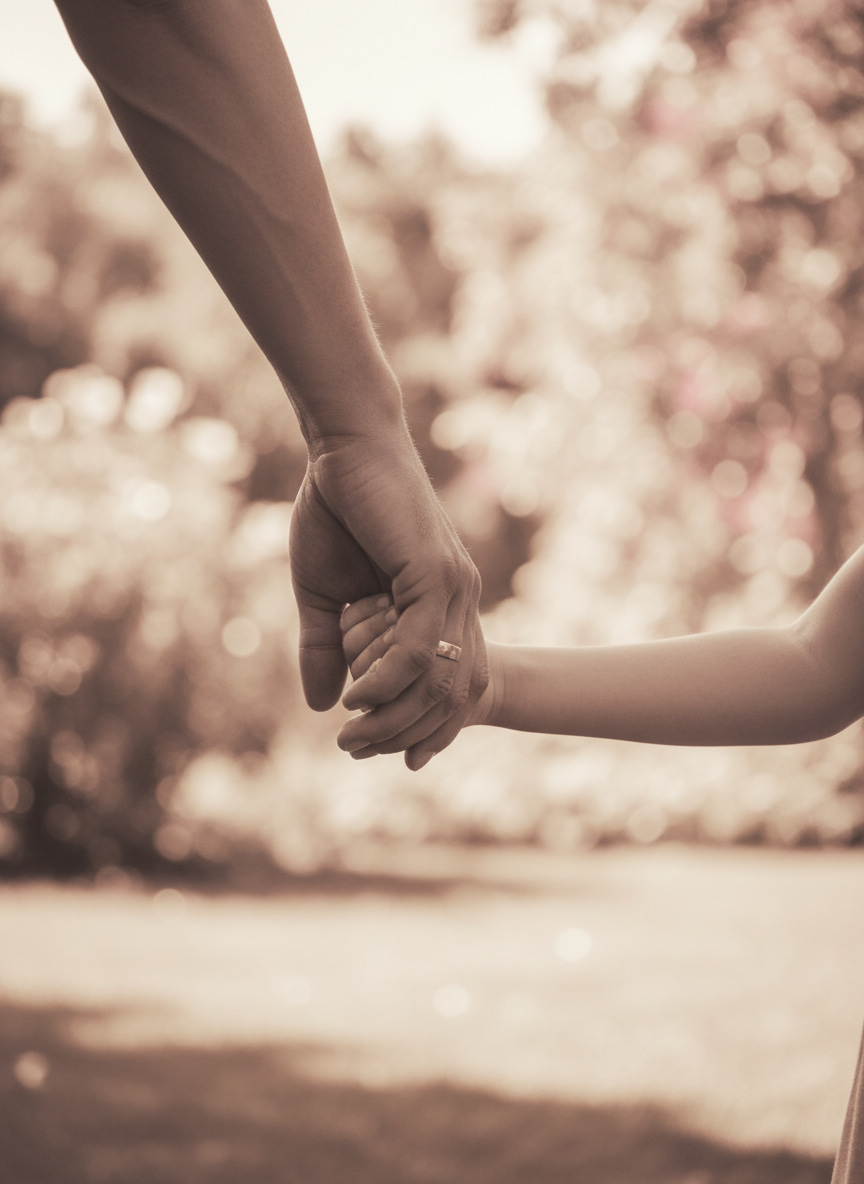 Father and child holding hands family moments