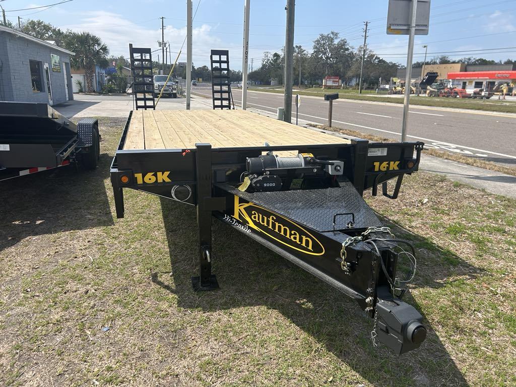 24' flatbed 16k kaufman trailer available for rent sitting by the road in hudson, fl