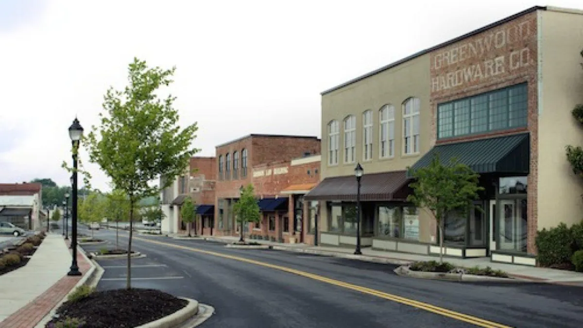 DryDoctors tech inspecting water damage in historic Uptown Greenwood home