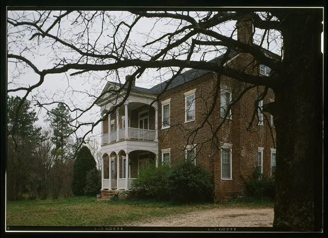 Flood response team pumping water from basement in Coronaca neighborhood, Greenwood