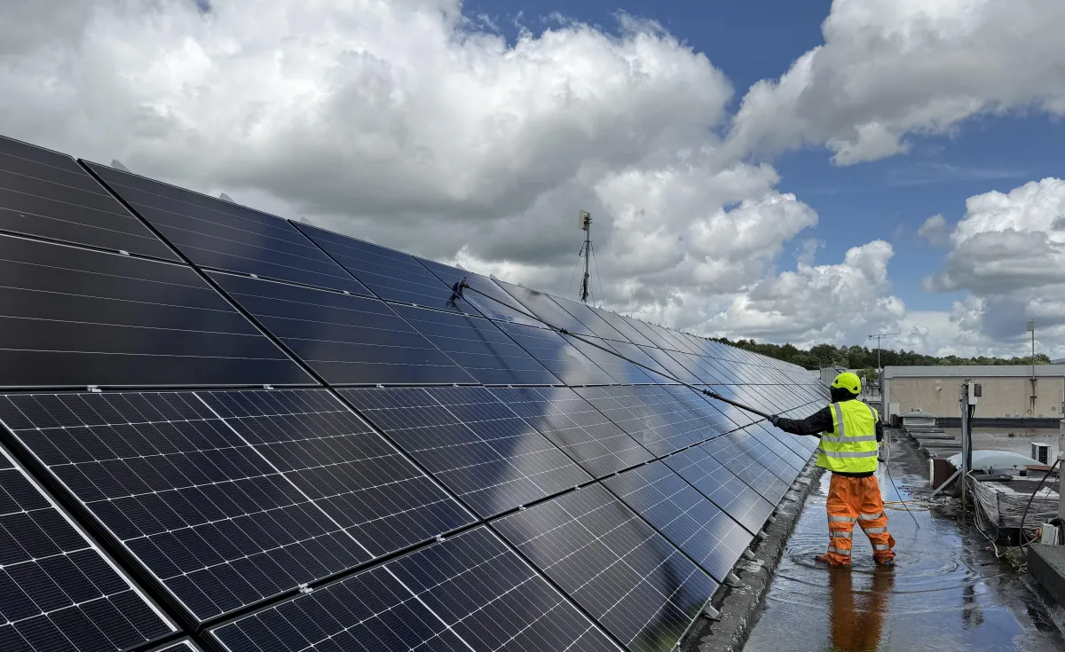 Commercial solar panels being cleaned with pure water