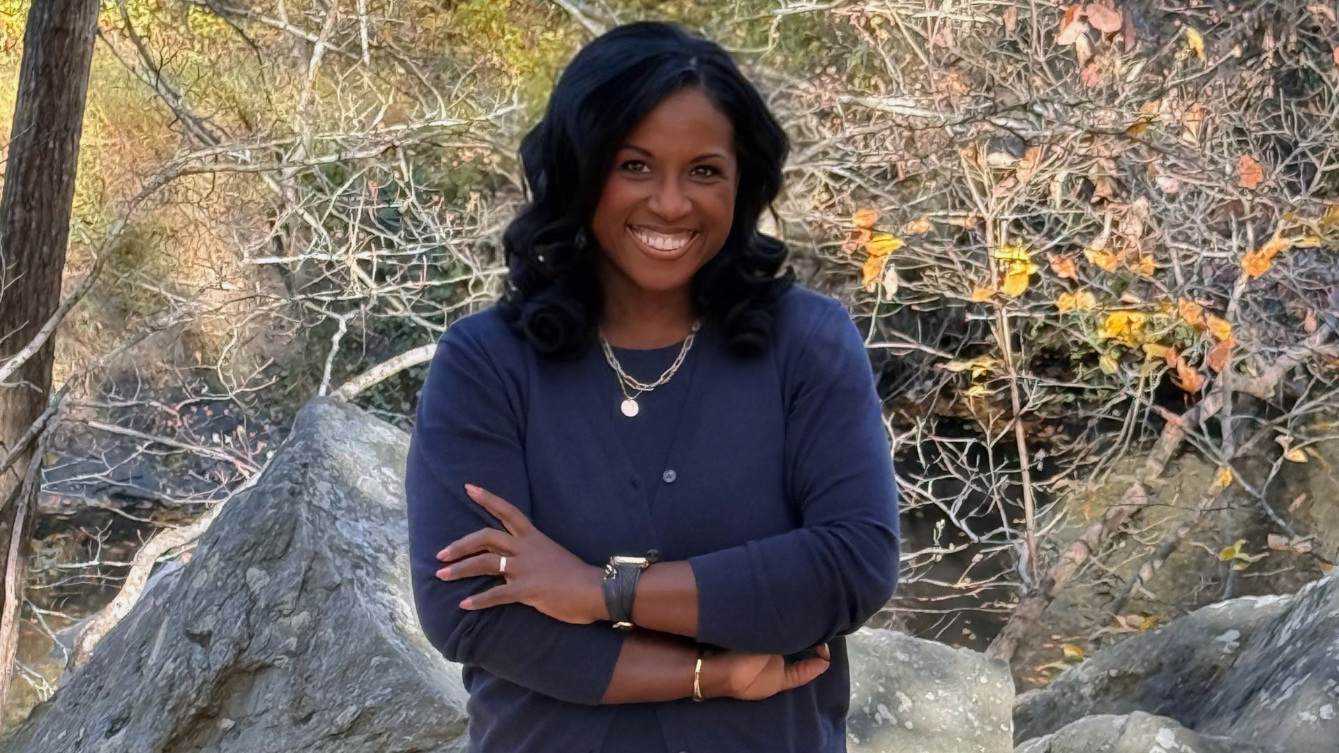 3 women holding brown cardboard box