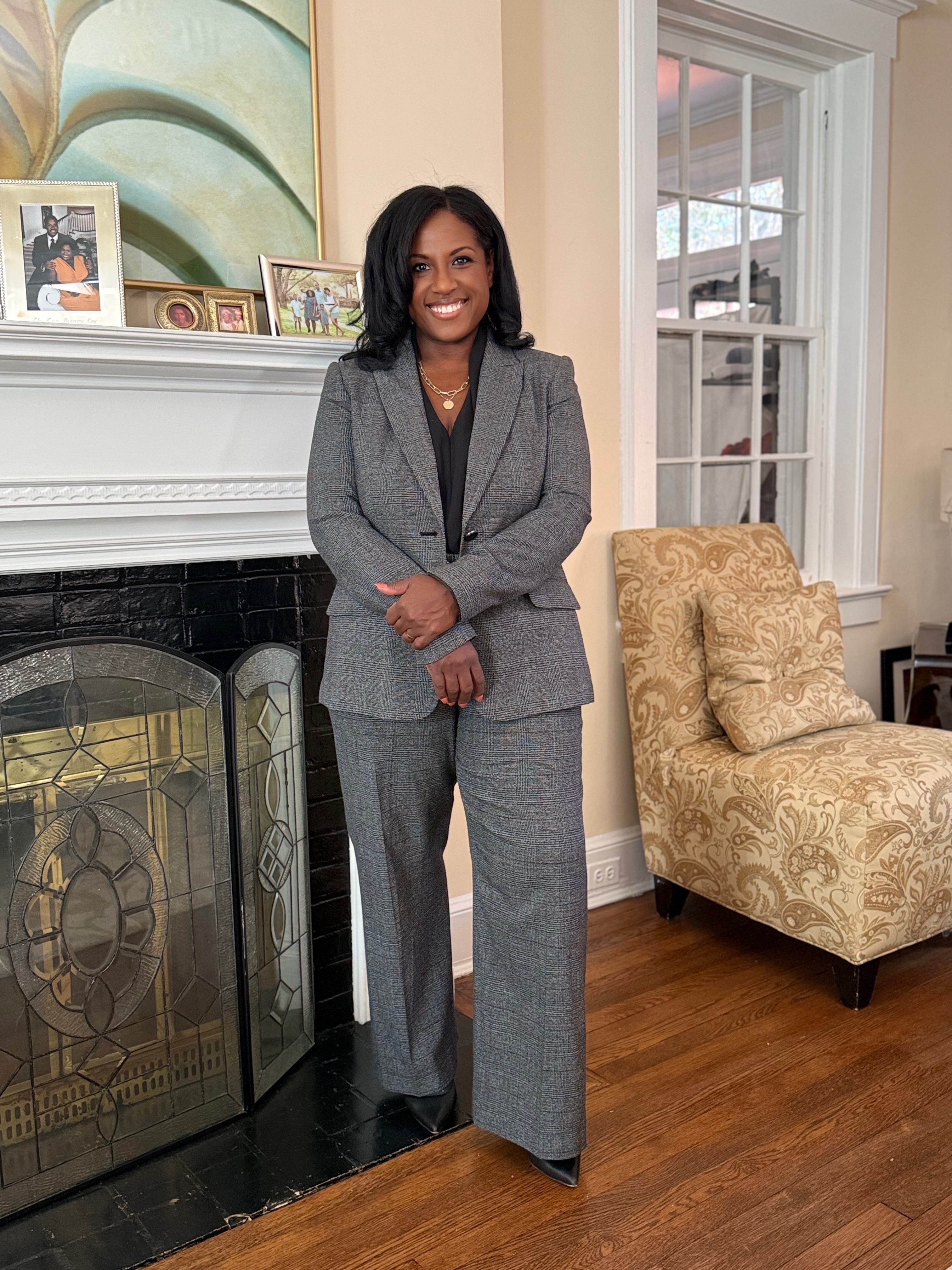 3 women holding brown cardboard box