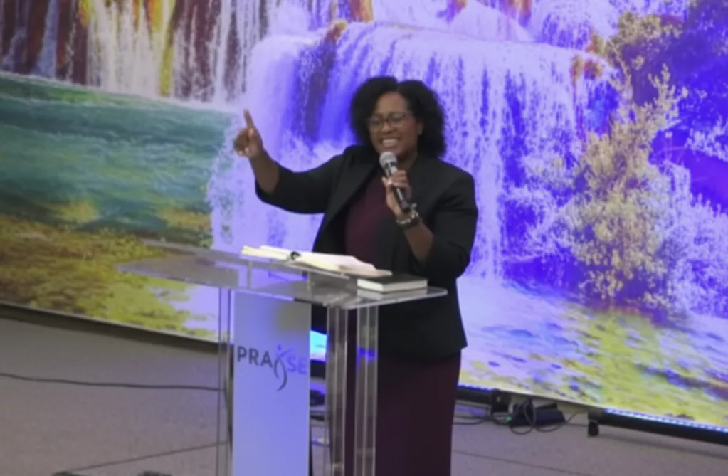 grayscale photo of 3 women sitting on wooden bench