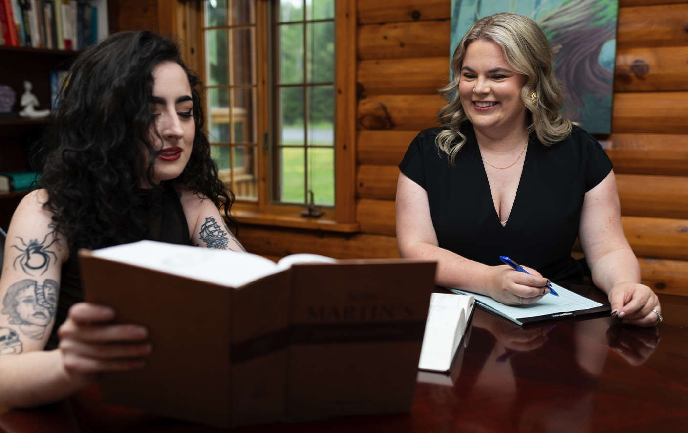 Larua and Spencer referencing a Law book