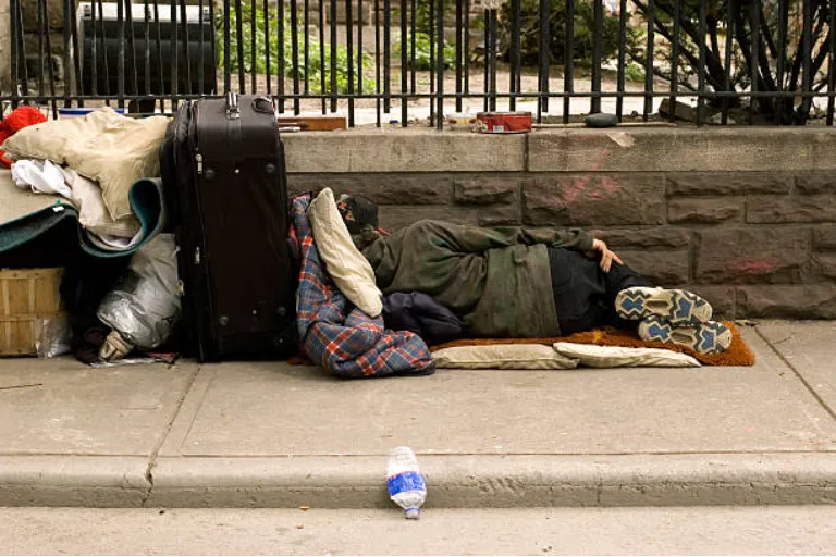 homeless-person-laying-in-street