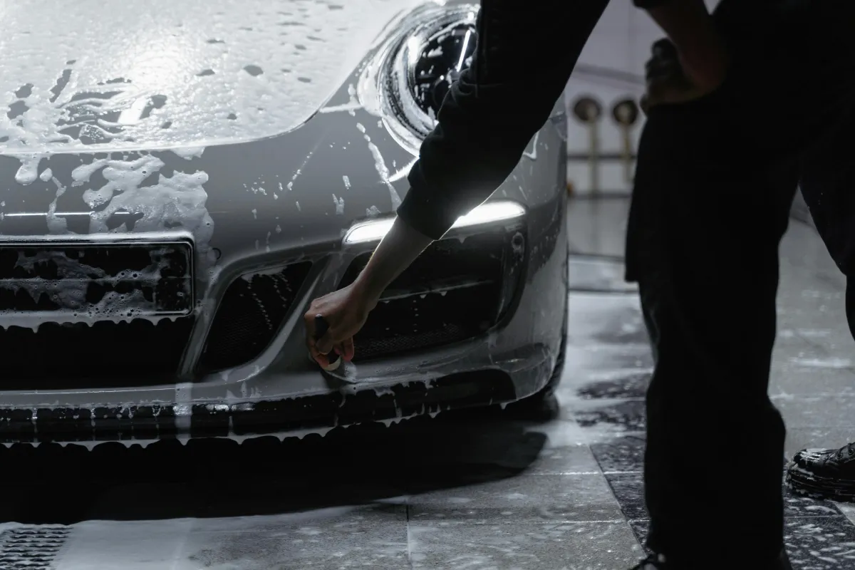a close up of a car parked on a street