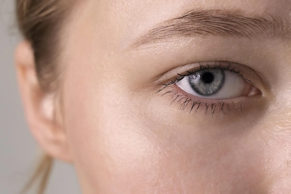 a close up of a person's brown eye