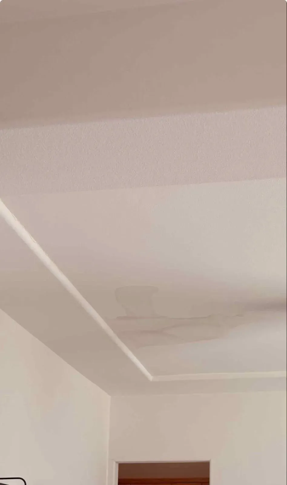 Water stained interior ceiling caused by roof leak  in Southern California home repaired by Dove Roofing