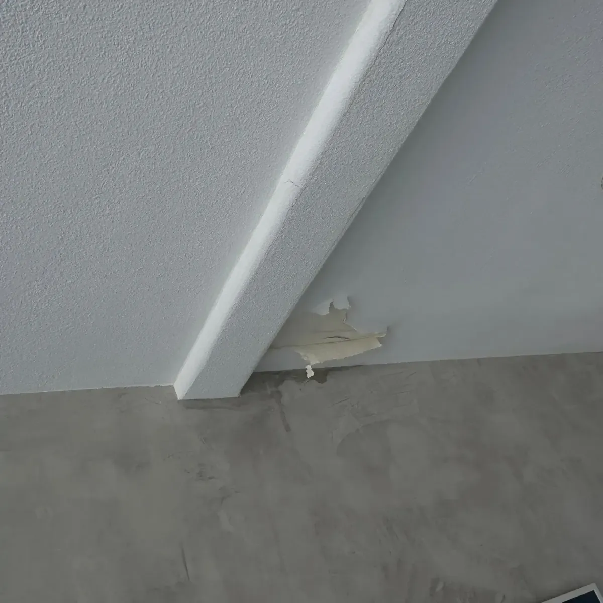 Interior ceiling showing water damage stains from  roof leak before Dove Roofing repair in Southern California