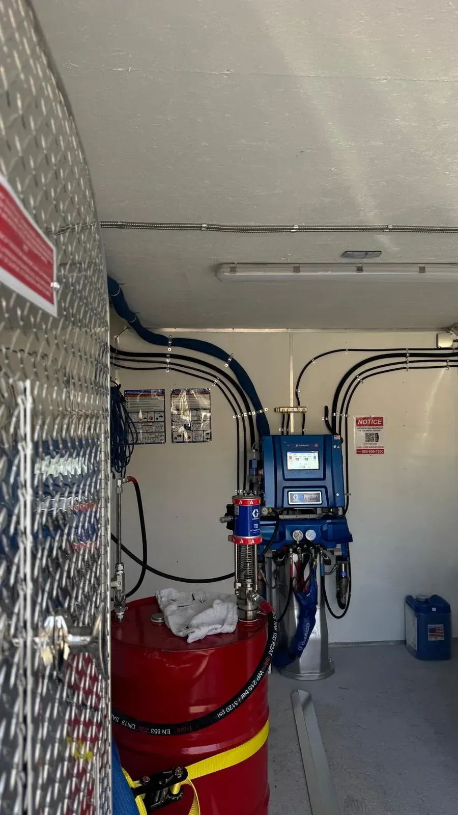 Graco spray foam roofing equipment inside Dove  Roofing professional application trailer Southern California
