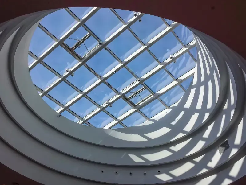 Architectural atrium skylight, shown for illustrative comparison only.