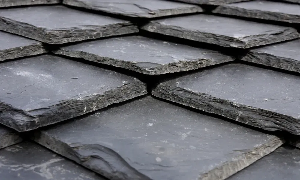 Torch flame heat-welding bituminous membrane on flat roof — what is the best roofing material for a flat roof