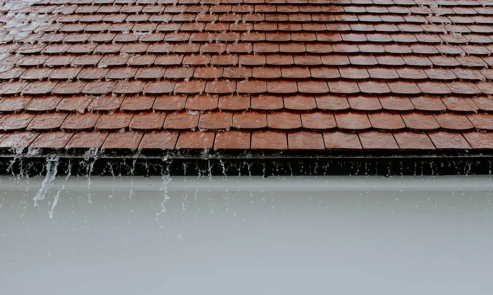 Torch flame heat-welding bituminous membrane on flat roof — what is the best roofing material for a flat roof