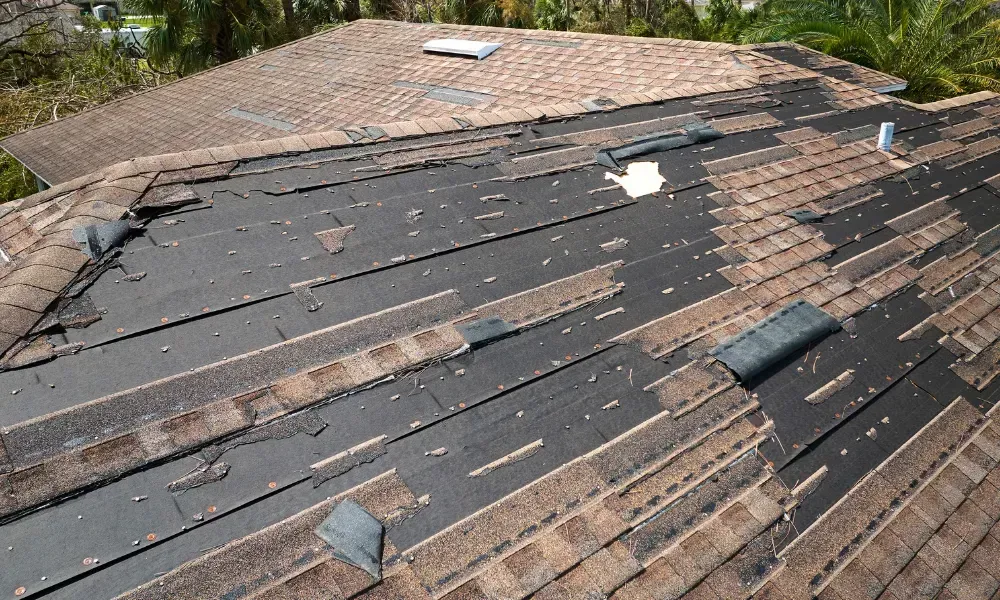 Aerial of crew tearing off old shingles and re-decking a home — roofing contractor near me Palm Springs