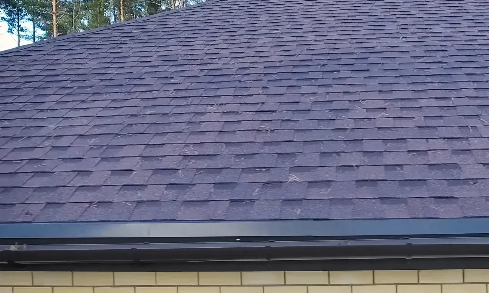 Torch flame heat-welding bituminous membrane on flat roof — what is the best roofing material for a flat roof