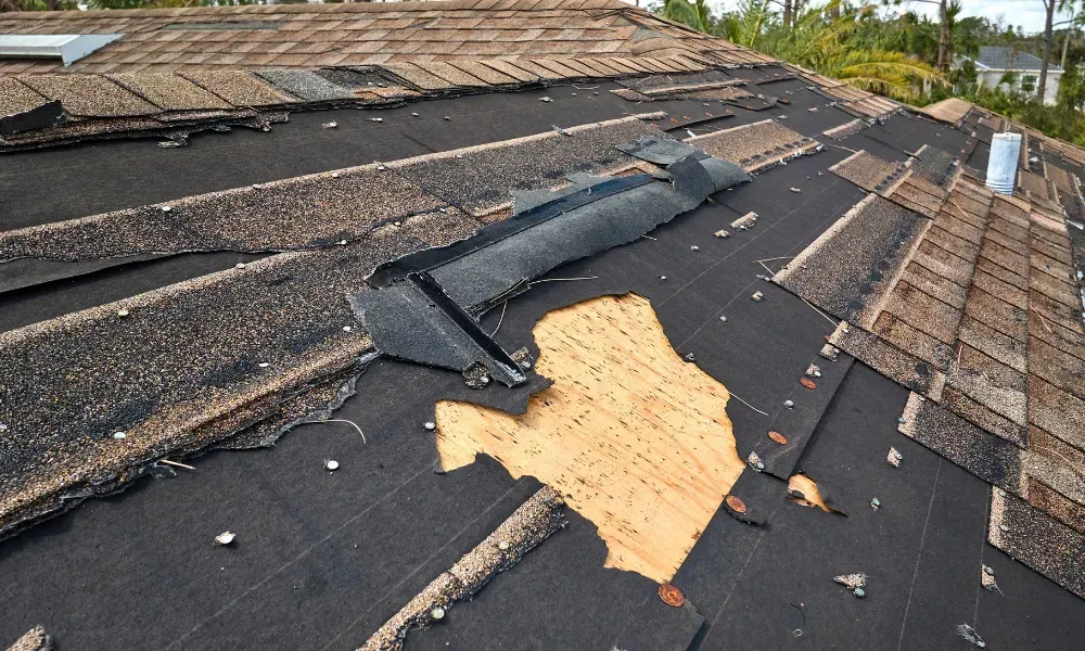 Aerial of crew tearing off old shingles and re-decking a home — roofing contractor near me Palm Springs