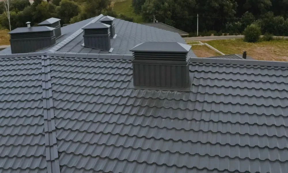 Torch flame heat-welding bituminous membrane on flat roof — what is the best roofing material for a flat roof