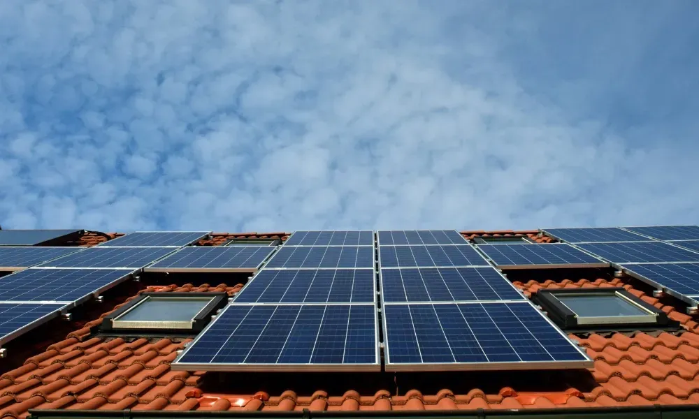 Torch flame heat-welding bituminous membrane on flat roof — what is the best roofing material for a flat roof