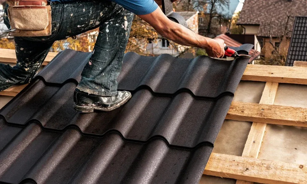 Hand lifting damaged shingle revealing gap at eave — what are signs of roof damage after a storm