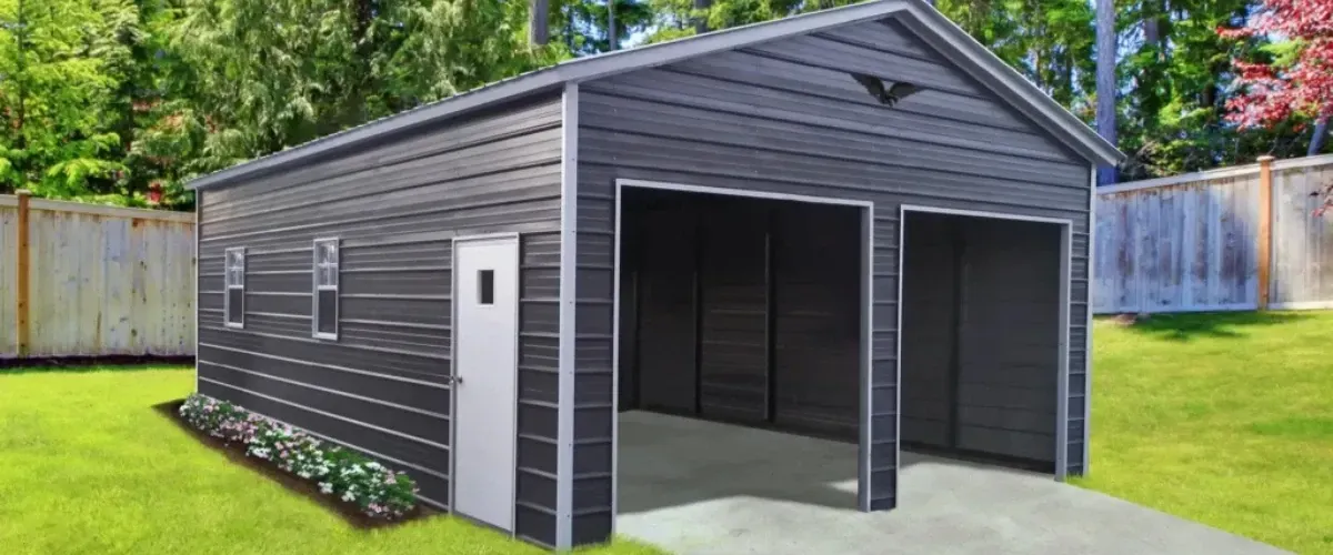 Modern double-door metal garage building in a backyard with grass and trees.