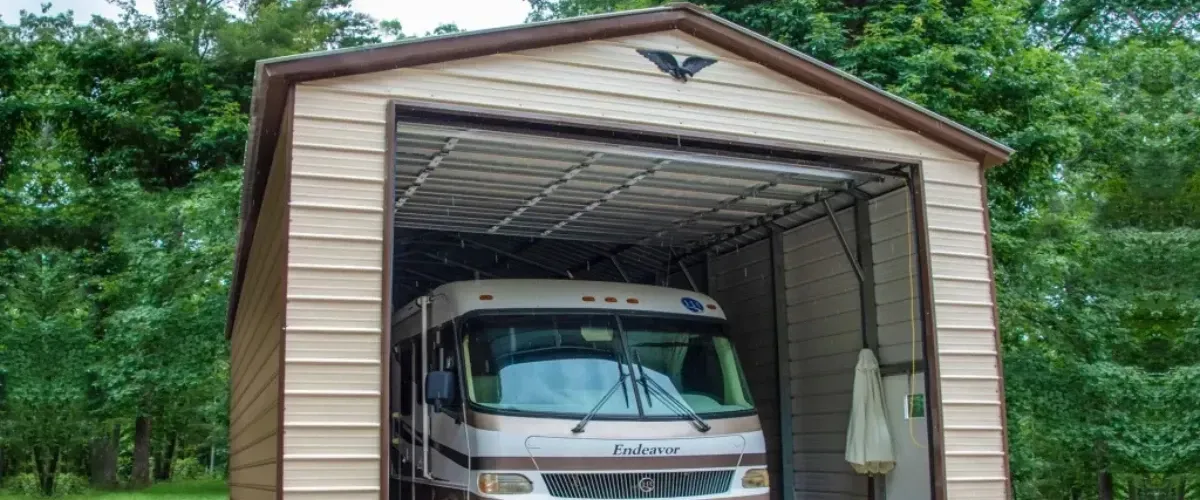 Tall metal garage building designed for RV storage with a motorhome parked inside