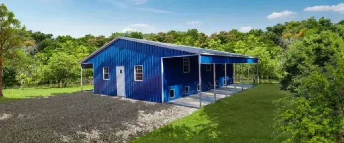 Blue metal barn with lean-to side overhang in rural setting