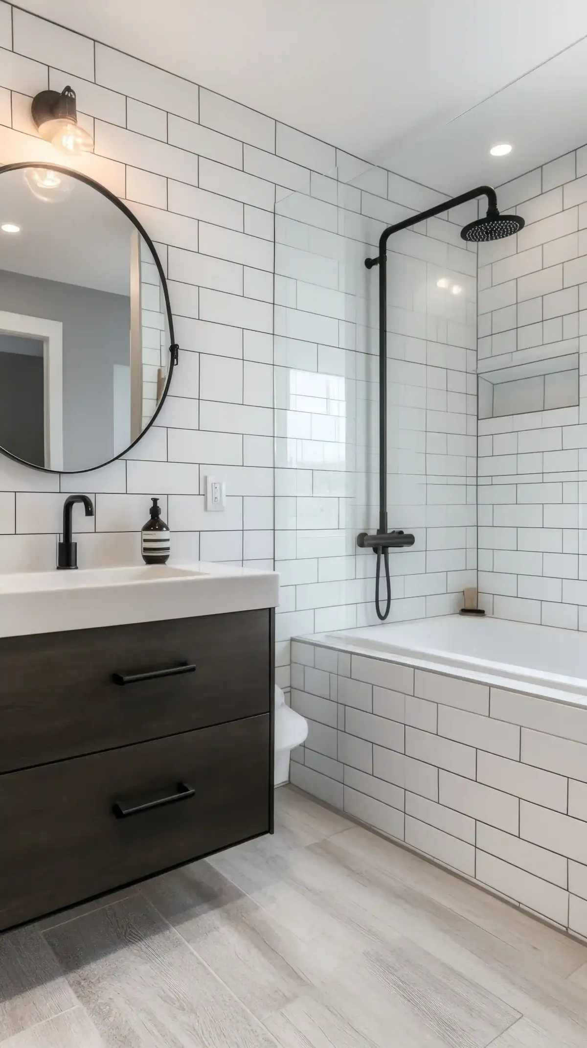 Modern bathroom renovation in Edmonton with white subway tiles, black fixtures, vanity and shower bathtub
