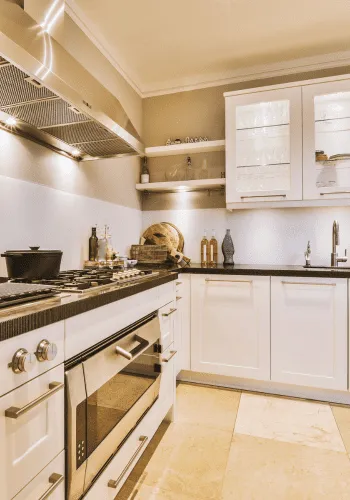 Completed kitchen renovation in St. Albert featuring new cabinetry, countertops, and tile backsplash