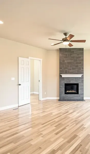 Gapped hardwood flooring boards in a Morinville home caused by dry winter air