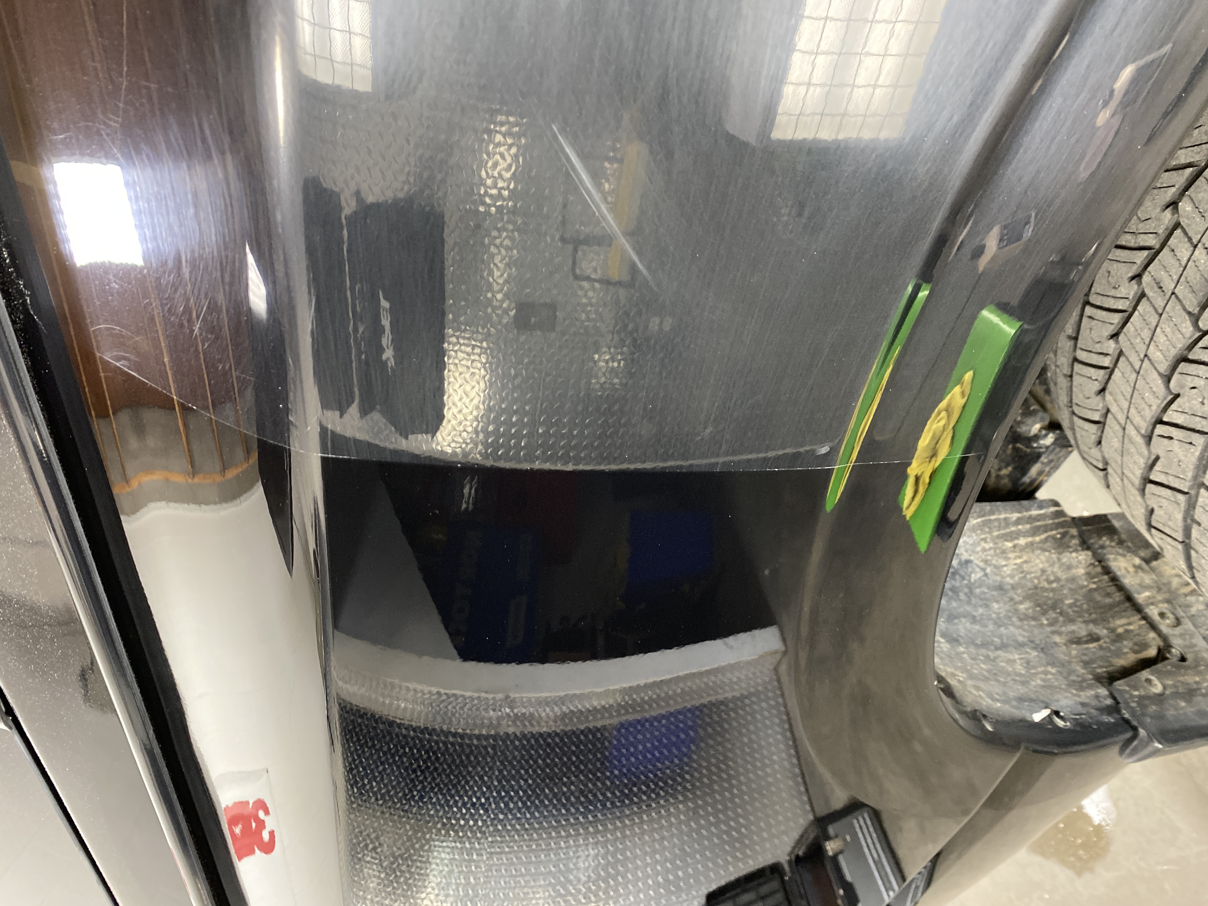 Hand using screwdriver on car headlight