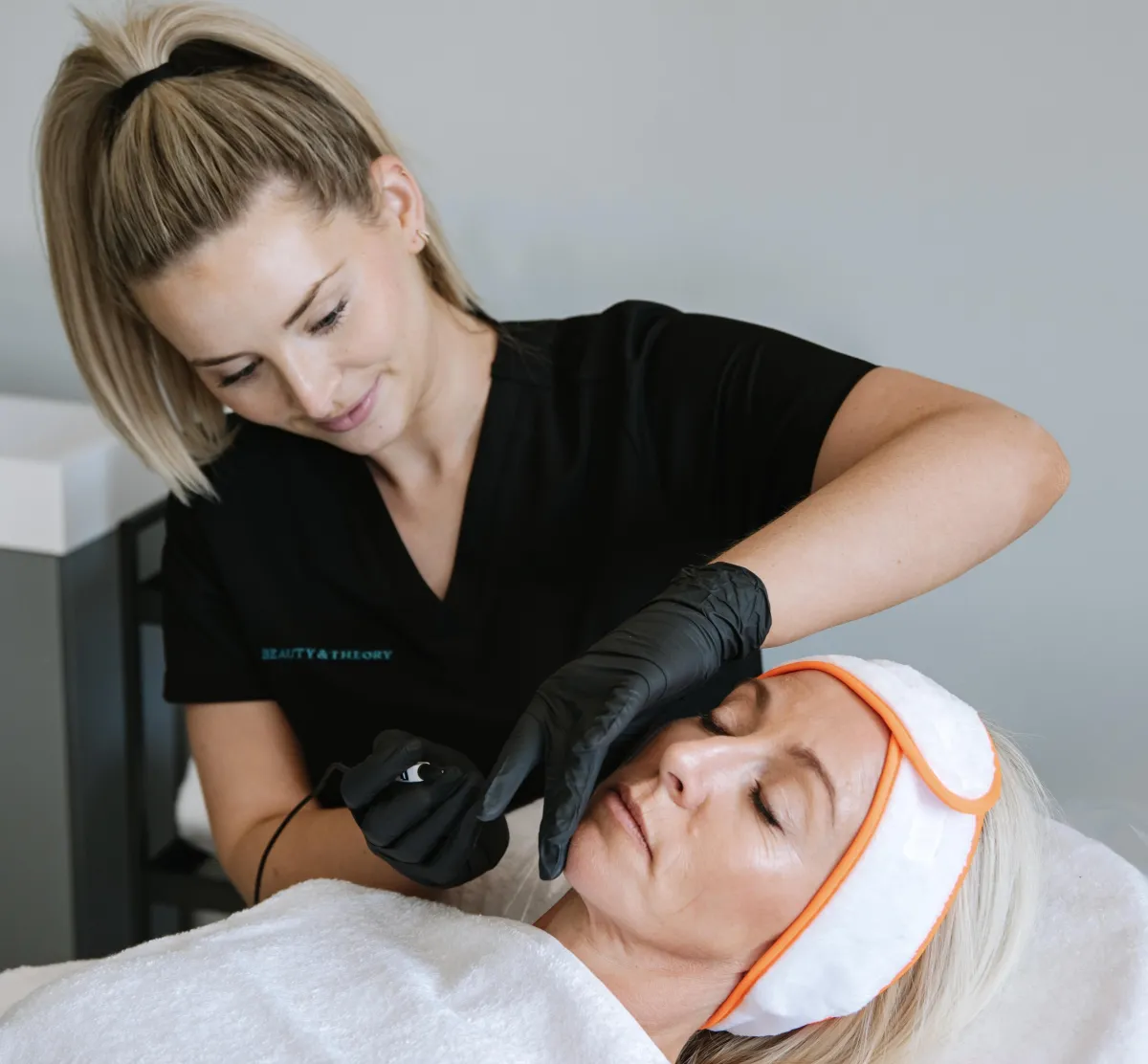 Student carrying out electrolysis on client