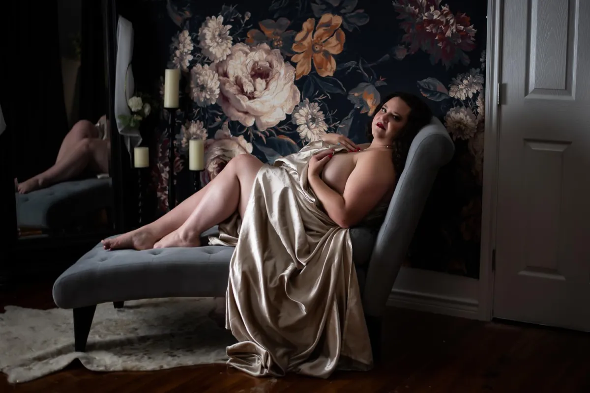 beautiful woman draped in sheets boudoir