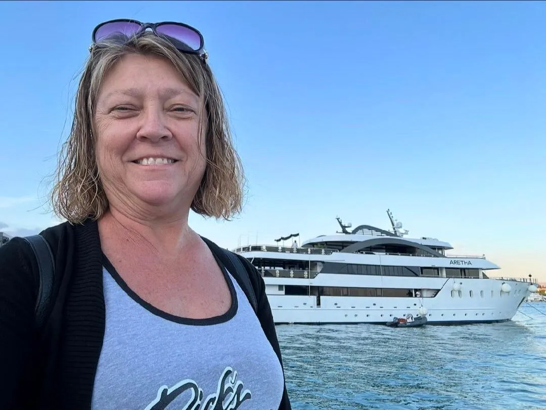 Cindy Lojewski, travel planner at Aspire 4 Travel, standing by the water in South Carolina