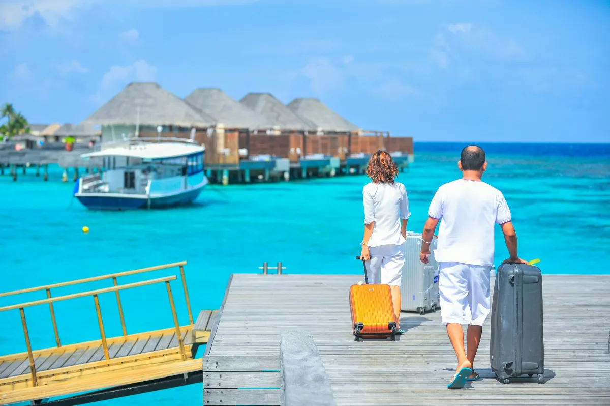 Couple 40+ beginning a custom adventure to overwater bungalows