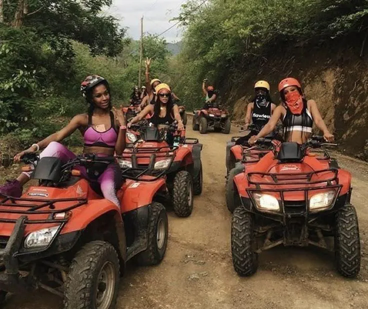 Women riding ATVs together at sunset—bold adventure retreat for women 40+.
